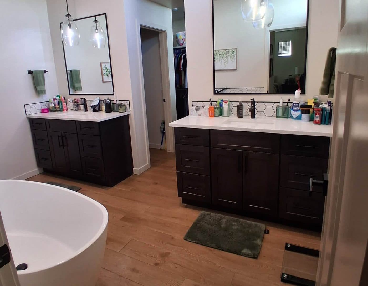 Bathroom with a freestanding tub and double vanity after a recurring house cleaning