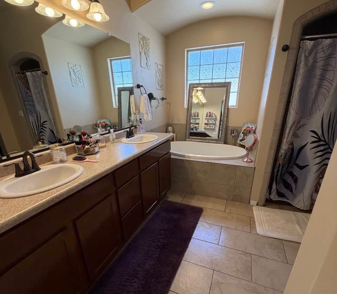 Bathroom double vanity and garden tub after a house cleaning
